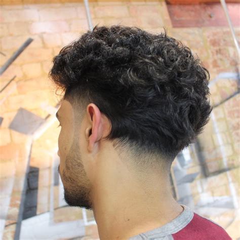 15 Best Curly Hair Haircuts + Hairstyles For Men