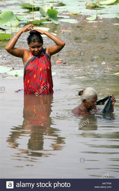Download This Stock Image Women Bathing At Bolgarh Village Orissa
