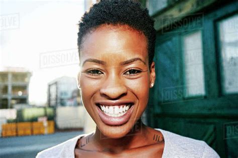 Portrait Of Smiling Black Woman Posing In City Stock Photo Dissolve