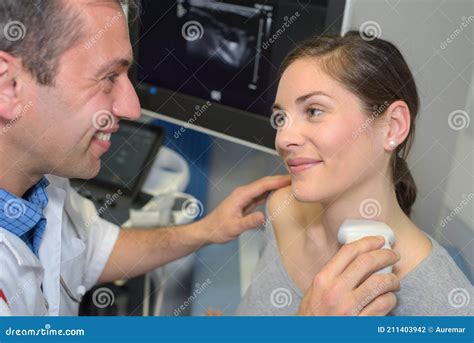 Young Woman Having Neck Ultrasound Examination At Hospital Stock Photo