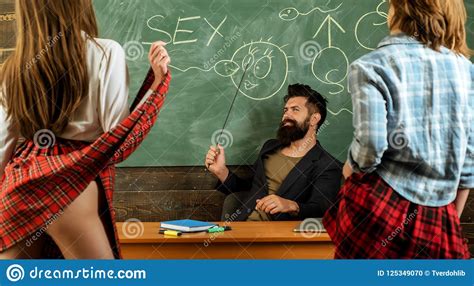Education Bearded Sexology Teacher Looks At Two Female Students