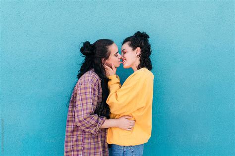 Young Women Kissing By Lucas Ottone Stocksy United