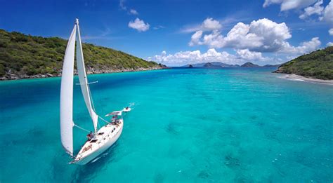 Aerial View Of A Sailboat Travelling Through The Caribbean Stock Photo