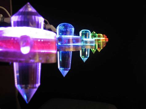 Crystals Suspended Above The Seven Chakras Used As Light Therapy