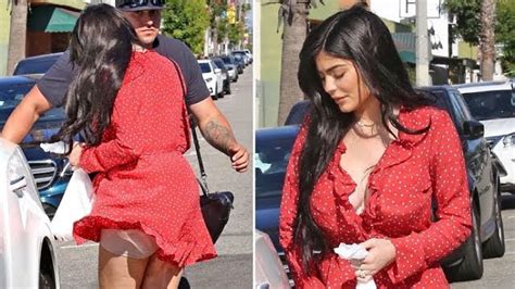 kylie jenner flashes her spanx as a gust of wind lifts up her tiny red dress ropa moda marca