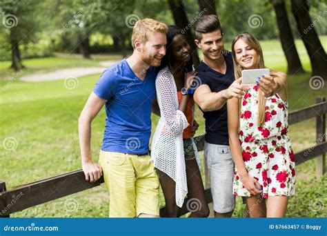 Young Multiracial Friends Taking Selfie In The Park Stock Image Image Of Adults Multiracial