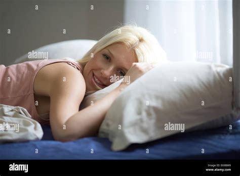 Women Laying Bed Window High Resolution Stock Photography And Images