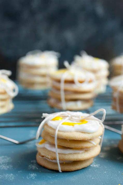 It isn't christmas without dozens and dozens of cookies coming out of the oven to take to friends, to give as gifts, and share at the table around the holidays. Lemon Butter Holiday Cookie Bundles ~ Macheesmo
