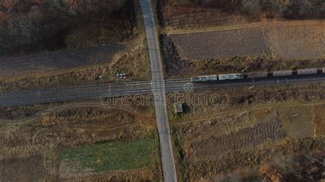 Top View Freight Train Passing Railway Crossing Aerial Drone View