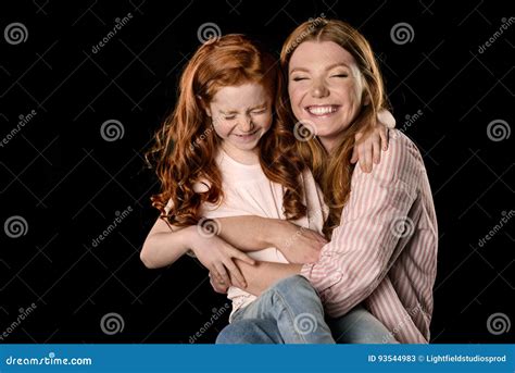redhead mother and daughter having fun together isolated on black stock image image of cute