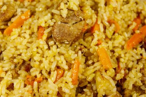 Premium Photo Pilaf With Meat Rice Carrot And Onion Close Up