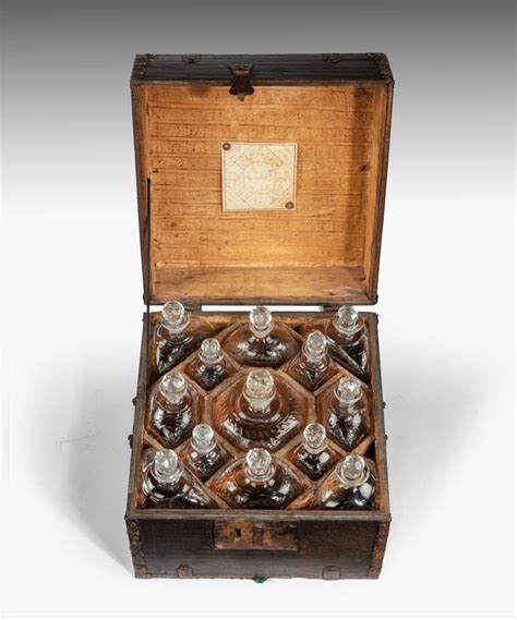 eighteenth century fitted decanter box with thirteen cut glass decanters bada