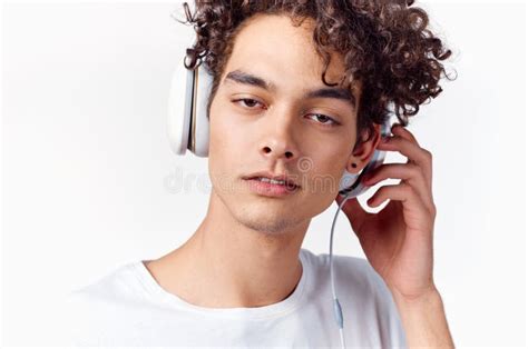 curly haired guy in headphones listening to music cropped view emotion stock image image of