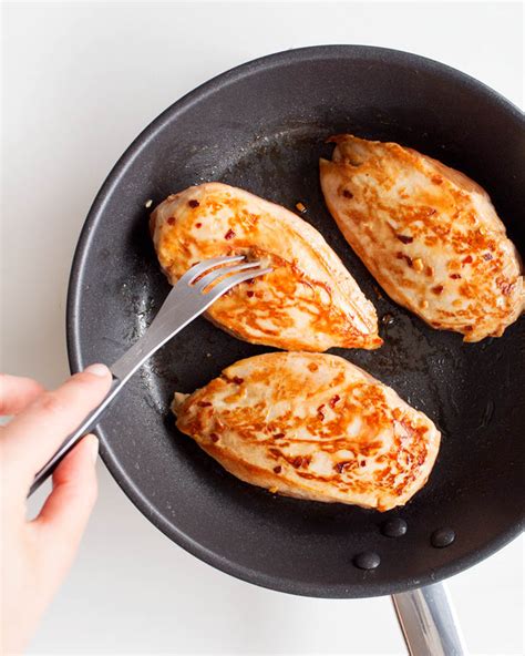 In a large covered skillet, heat the olive oil on medium heat. How to Cook Moist Chicken Breast in a Pan - Shoot the cook ...