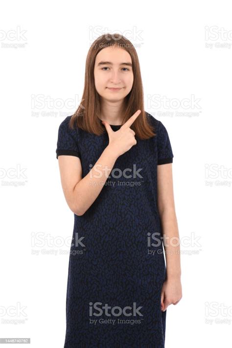 Young Beautiful Girl In A Dark Blue Dress On A White Background Stock