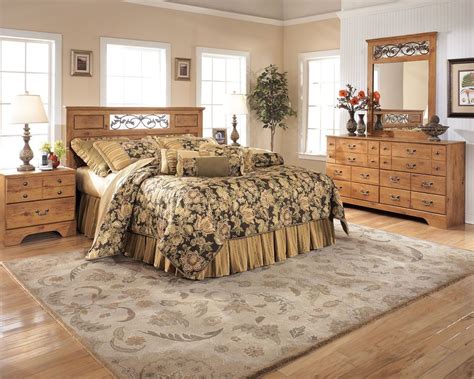 With the replicated pine grain covering the raised panel details Bittersweet - Light Brown - 4 Pc. - Dresser, Mirror, Queen ...