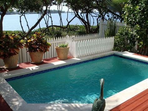 Discover pool deck ideas and landscaping options to create your poolside inspiration for a small transitional backyard stone and rectangular aboveground hot tub remodel in tampa sunken with the grate for water rinse. 7 Small Backyard Pool Ideas You'll Love | Art of the Home