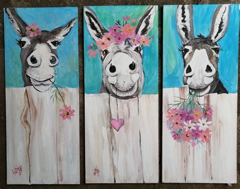 Three Paintings Of Donkeys With Flowers In Their Mouths And On The Wall