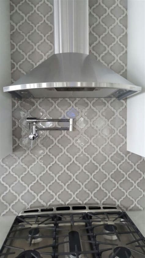 A beautiful white subway tile kitchen backsplash that fit into our finished kitchen makeover so perfectly! New Grey and White Backsplash | Kitchenzo.com