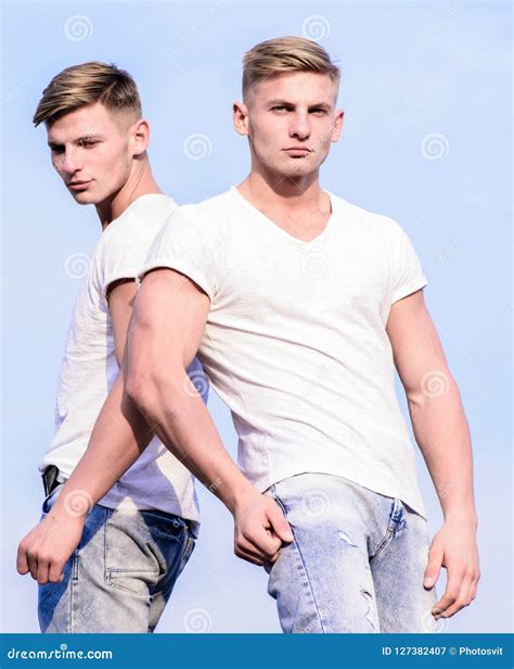 Attractive Twins Relaxing Men Muscular Chest Naked Torso Sky
