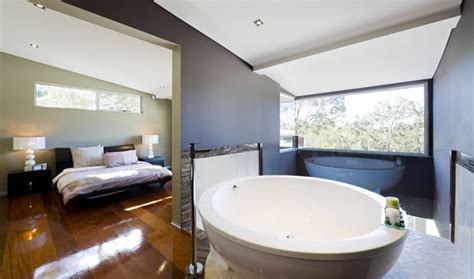 A Modern Open Concept Master Suite With A Bathroom Just Around The