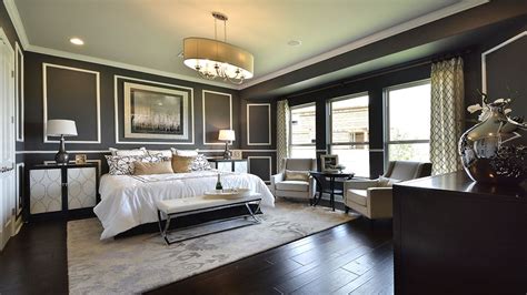Art Deco Master Bedroom With Crown Molding And Chandelier In