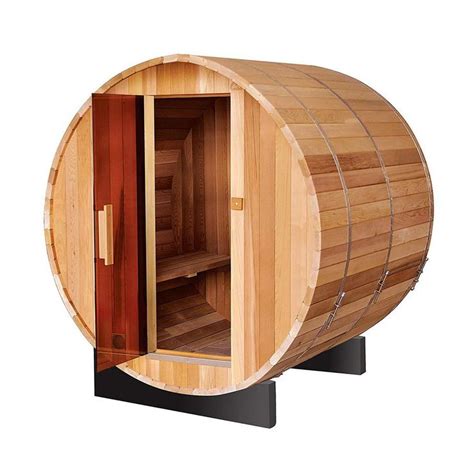 A Wooden Barrel Sauna Is Shown With The Door Open To Show Its Interior
