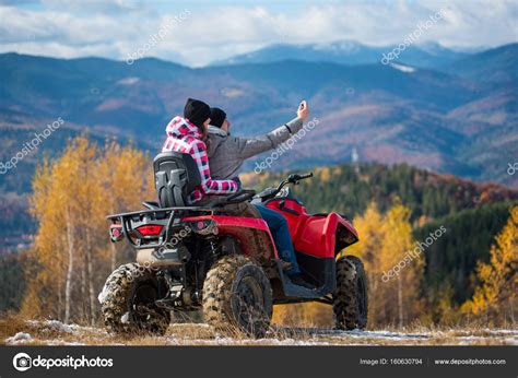 Couple On Four Wheeler Atv In Mountains — Stock Photo © Anatoliygleb
