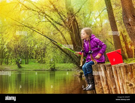 Girl Fishing Near Beautiful Pond With Fishrod Stock Photo Alamy