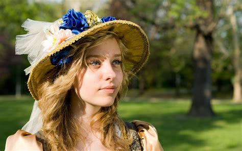 Online Crop Girl In Brown Sun Hat With Trees And Grass Field In The