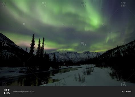 Aurora Borealis Or Northern Lights Above The Mountains And Over The