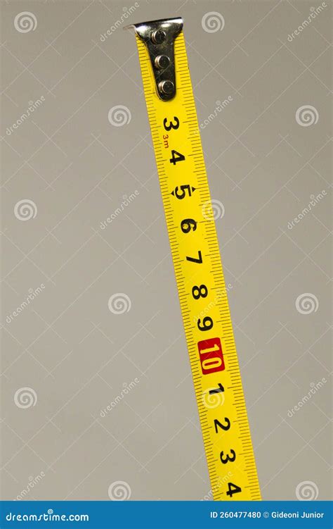 Yellow Centimeter Tape Measure On Neutral Background Stock Photo