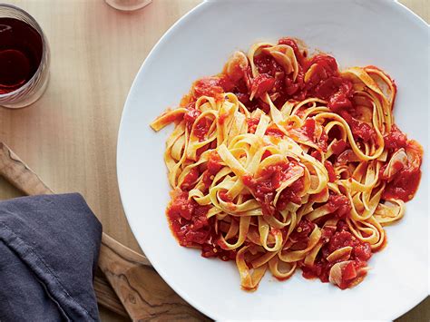 You can whip up soups, chilis, pastas, and more, with its bright and tangy dress up tomato sauce with a few herbs and spices, plus its beloved companions of onions and garlic, and you're halfway to having a meal. Tagliatelle with Garlicky Tomato Sauce Recipe | Food & Wine