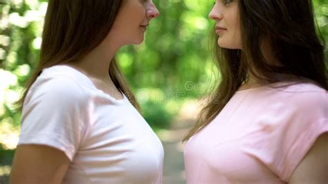 Affectionate Kiss Of Two Attractive Lesbians First Love Secret Meeting Closeup Stock Photo