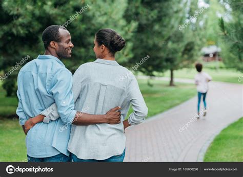 African American Couple In Park — Stock Photo © Alexnazaruk 163630290