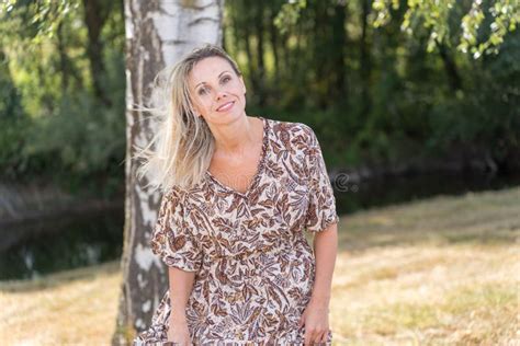 Playful Mature Woman Outdoors In The Greenery Stock Image Image Of Blond Aged 259013925