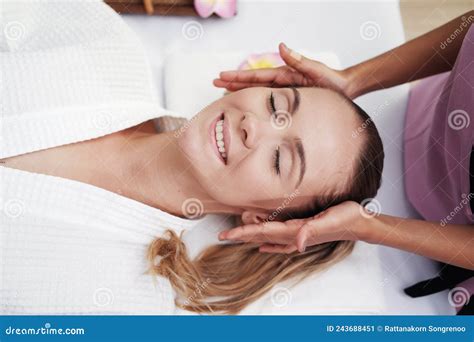 Asian Massage Therapist Woman Is Making Traditional Head And Facial Treatment Massage To
