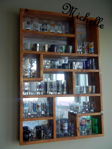 Displaygifts 41 shot glass display case with walnut finish. Everyone should have the proper place to put their shot ...