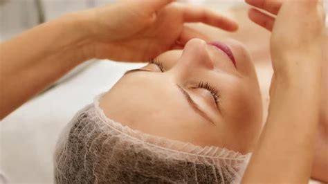 Beautician Cosmetologist Makes Lymphatic Drainage Facial Massage Stock Footage