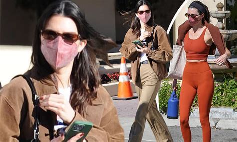 Kendall Jenner Plays Up Legs In Khaki Slacks After Flashing Taut