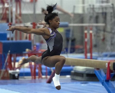 The Artistry Of Simone Biles In Action