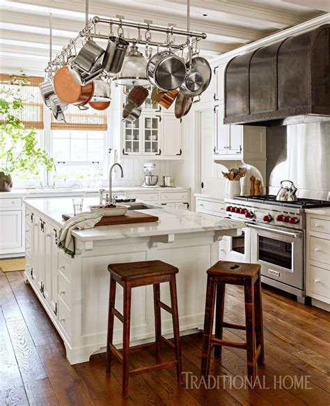 We opened up the walls to create a new gathering kitchen with clean views and a classic mix of materials. A Historicaly Inspired Dutch Colonial by Gil Schafer - The Glam Pad | Kitchen interior, Interior ...