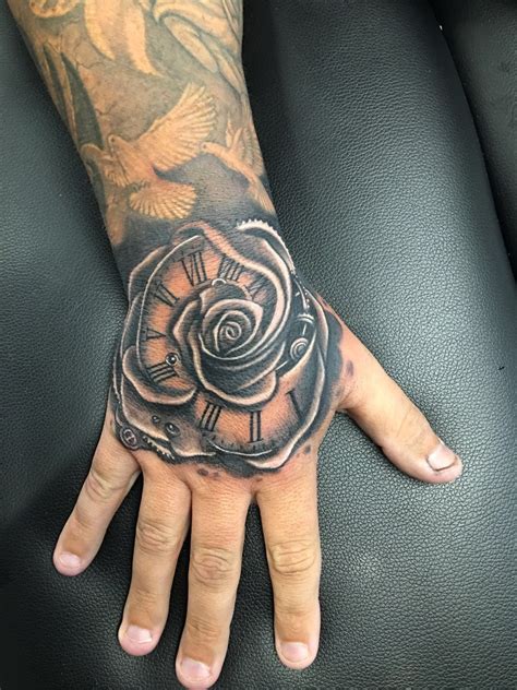Rose Hand Tattoo By Greg At Holy Trinity Tattoos Rose Hand Tattoo