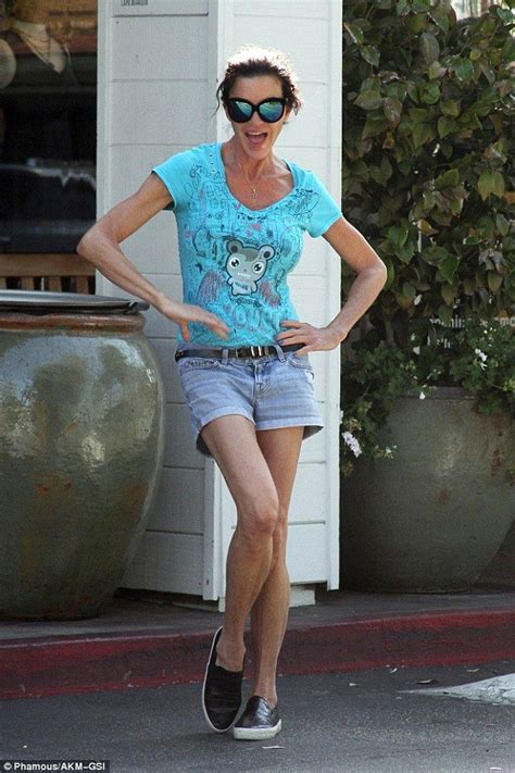 Janice Dickinson Shows Off Her Exceedingly Slim Legs In Daisy Dukes