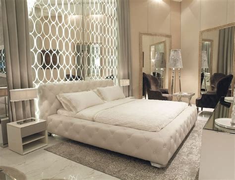 Art Deco Master Bedroom With High Ceiling And Simple Marble