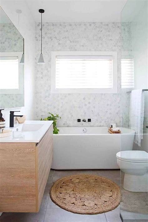 The key is to find one that's streamlined and modern — think sleek hardware, solid or flat panel cabinet doors, and minimalist legs. Aesthetically Stunning Scandinavian Bathroom Ideas For Your Inspiration | DecorTrendy