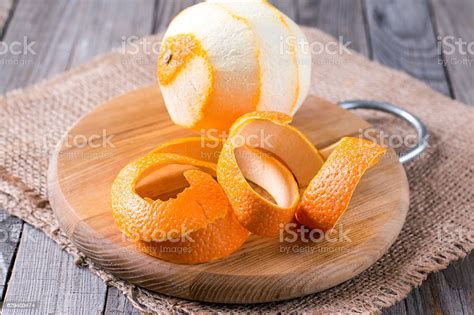 Peeled Orange On The Wooden Background Stock Photo Download Image Now