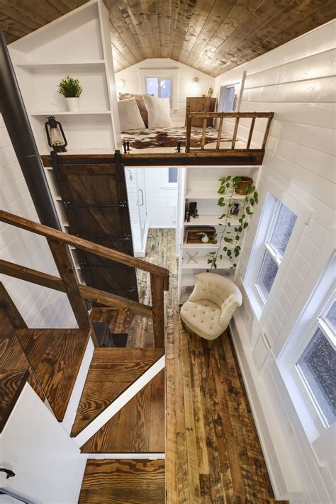 Maximize vertical space and get more storage by an excellent tiny house interior idea is to install ladders instead of steps! Rustic Loft - Tiny House Swoon
