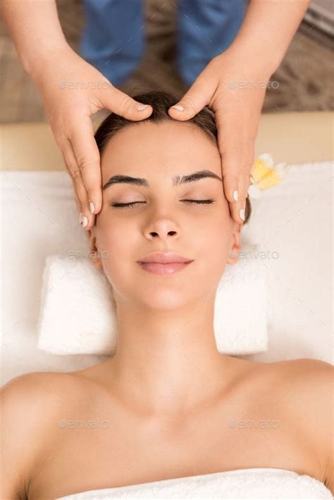 Attractive Woman Relaxing And Having Head Massage In Massage Salon Head Massage Attractive
