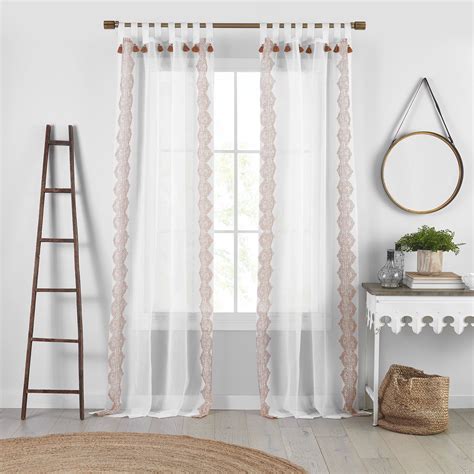 This room is very white if you didn't already notice. Shilo Boho Sheer Tab Top Window Curtain Panel with Tassels ...